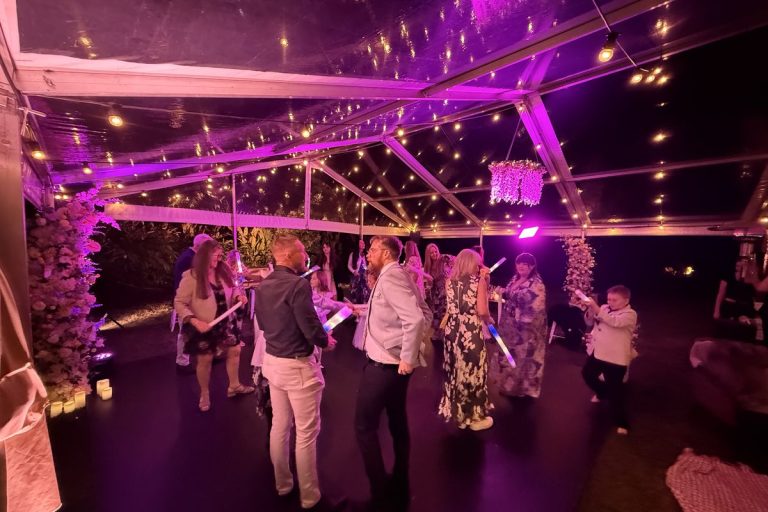 Clear-roof structure marquee with a timber dance floor and festoon lights